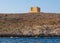 Saint Mary`s Tower, or Comino Tower, shot from the water