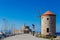 Saint Nikolas fort and medieval windmill in Mandraki port, Rhodes