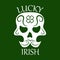 Saint Patrick day symbol of skull with mustaches and four-leaf clover leaf or lucky Irish shamrock.