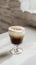 Saint Patrick's Day Irish coffee in glass, creamy layer, traditional drink, festive, copy space