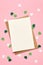 Saint Patricks day invitation card mockup with envelope, green paper shamrock on pink background