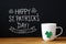 Saint Patricks Day message with a white mug