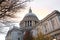 Saint Paul`s Cathedral, one of the most famous and most recognisable sights of England, with bare tree branch, London, United