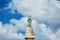 Saint Peter statue among clouds in Rome