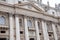 Saint Peters Basilica facade exterior with colums and frieze inscription in Vatican