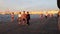 Saint Petersburg, the Arrow of Vasilievsky island, people walk along the embankment of the Neva river, sunset.