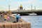 Saint Petersburg, Blagoveshchensk bridge, Neva river embankment, St. Isaac`s Cathedral dome, summer day.