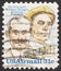 Saint Petersburg, Russia - November 25, 2019: Postage stamp printed in USA with a portrait of Orville and Wilbur Wright, And Flyer