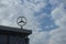 Saint Petersburg, Russia, October 2020: Mercedes sign rotating on the roof of a building against the background of clouds, Mercede
