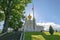 .Saint-Petersburg - Russia October 4, 2022: Petergof. Grand Palace church with Russian flag in the lower park of