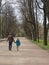 Saint-Petersburg, RUSSIA â€“ May 1, 2019: Father and son walking along the alley in Alexander garden in spring day