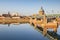 The Saint Pierre Bridge and the dome of the La Grace Hospital reflecting in the Garonne, Toulouse.