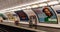 Saint Sebastien. Parisian subway station with passenger and advertising posters