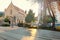 Saint Stephen church in the evening, Bratislava, Slovakia. Yellow glares and shadows on the pavement from sunlight