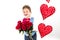 Saint Valentine`s day. Handsome gentleman boy with blue vest, red tie, red roses bucket and red balloons . Valentines day kids. L