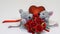 Saint Valentines day. Lovely gray mouse gives rose to his girlfriend on the background of the decorative heart