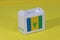 Saint Vincent flag on white box with barcode and the color of nation flag on yellow background. The concept of export trading from