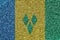 Saint Vincent and the Grenadines flag depicted on many small shiny sequins. Colorful festival background for party