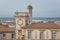 Saintes-Maries-de-la-Mer, top view of town tiled roofs, building of ancient Town Hall and seaside, Camargue, France