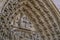 Saints in portal of Notre-Dame facade. Architecture sights of Paris.