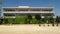 Saitama / Japan - 08/12/20: An empty schoolyard with playground equipment and buildings on a sunny day.