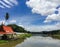 Sakae Krang Riverside On Blue Cloudy Sky Background In Uthai Thani Province, Thailand