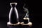 Sake  a traditional distilled and fermented alcoholic drink from Japan  served hot  produced from rice  water and kÅji. Black