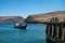 Sakhurta, Russia - May 1, 2018: Ferry dock on the island of Olkhon. Lake Baikal. People are waiting on the shore for