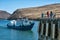 Sakhurta, Russia - May 1, 2018: Ferry dock on the island of Olkhon. Lake Baikal. People are waiting on the shore for