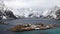 Sakrisoy island between snow covered mountains at the Reinefjorden on the Lofoten in Norway in winter