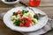 Salad with arabic couscous and vegetables on a plate