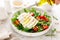 Salad with arugula, mozzarella cheese and pine nuts. Breakfast. Ketogenic, keto or paleo diet. Healthy food.