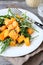 Salad with arugula and pumpkin on a plate