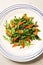 Salad with arugula rucola and caramelised carrot