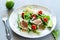 Salad with arugula, tomatoes and prosciutto. Italian cuisine. Healthy eating. Diet