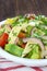 Salad with avocado, cheese and tomato