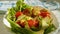 Salad avocado tomato sprinkle cheese, slow-motion