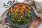 Salad with baked pumpkin, lentils on a table