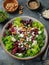 Salad with beet or beetroot, green mix lettuce, nuts, feta cheese