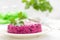 Salad of boiled beet. Beetroot salad with prune, walnuts and sour cream on white background