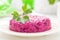 Salad of boiled beet. Beetroot salad with prune, walnuts and sour cream on white background