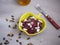 Salad of boiled beets, sunflower seeds and pumpkin and feta cheese in a yellow ceramic salad bowl, seasoned with vegetable oil