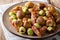Salad from boiled chestnuts, fried Brussels sprouts and bacon cl