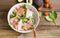 Salad bowl with prosciutto ham, parmesan cheese , walnuts and fresh green leaves top view, healthy italian gourmet tasty salad top