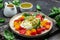 Salad burrata cheese tomatoes and green pesto. Delicious balanced food concept. superfood concept. Healthy, clean eating. Vegan or