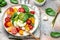 Salad burrata cheese tomatoes and green pesto. Delicious balanced food concept. superfood concept. Healthy, clean eating. Vegan or