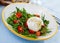 Salad with burrata italian cheese, cherry tomatoes and arugula green leaf