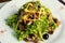 Salad with chicken, mushrooms and leaves of Iceberg lettuce and