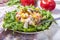 Salad of chicken tenderloins with avocado, tomatoes, sweet pepp