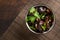 Salad of chinese pickled tree black muer mushrooms in bowl on brown background.